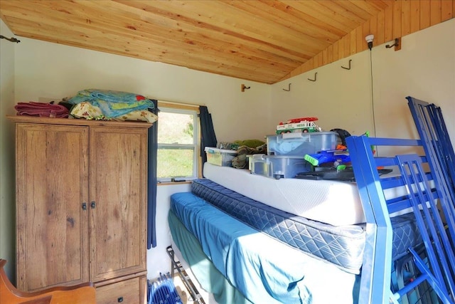 bedroom with vaulted ceiling and wooden ceiling