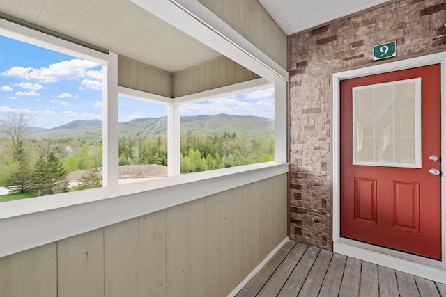 view of exterior entry with a mountain view