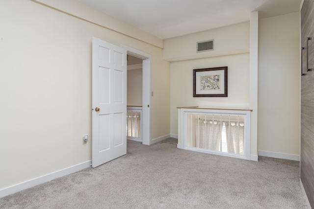 interior space with visible vents and baseboards