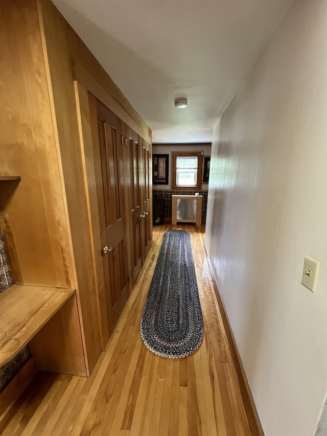 hallway featuring light wood-style flooring