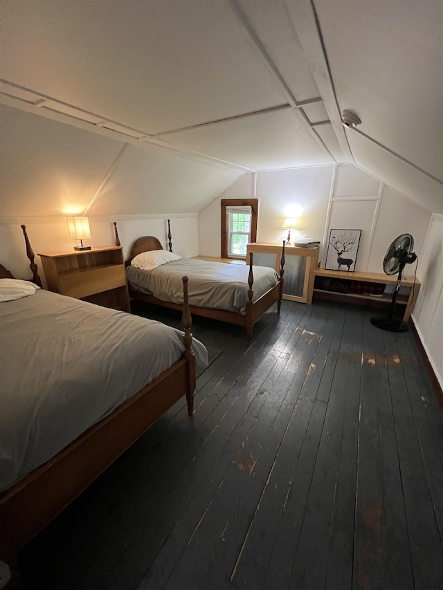 bedroom featuring lofted ceiling and wood-type flooring