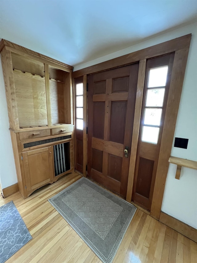 foyer featuring light wood finished floors