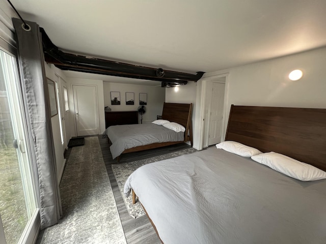 bedroom featuring wood finished floors