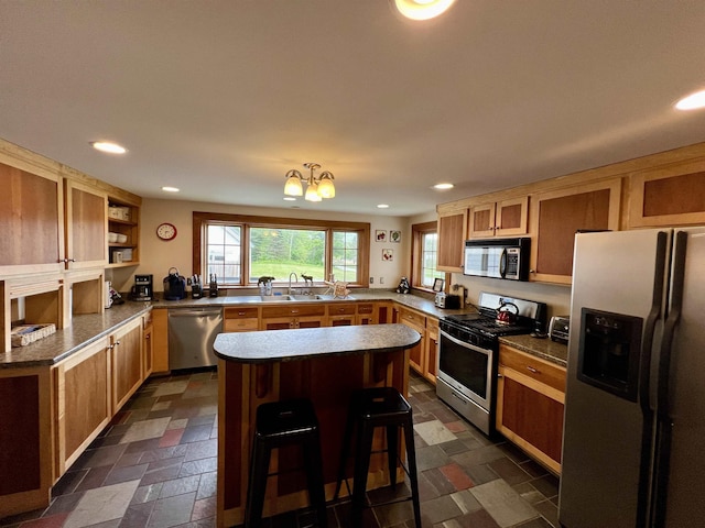 kitchen with a kitchen island, stainless steel appliances, stone tile flooring, open shelves, and recessed lighting