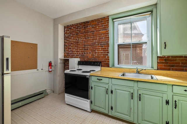 kitchen with a baseboard radiator, brick wall, white appliances, a sink, and green cabinetry