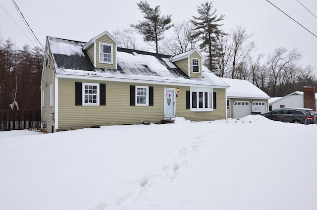 cape cod house featuring a garage