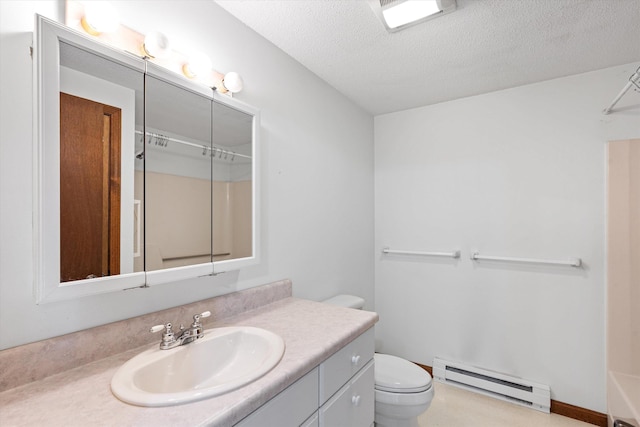 full bath with a textured ceiling, a baseboard radiator, toilet, vanity, and a tub