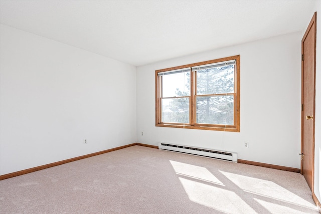 empty room featuring baseboards, light carpet, and baseboard heating