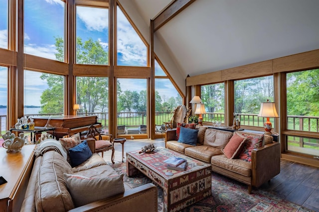 sunroom with lofted ceiling with beams