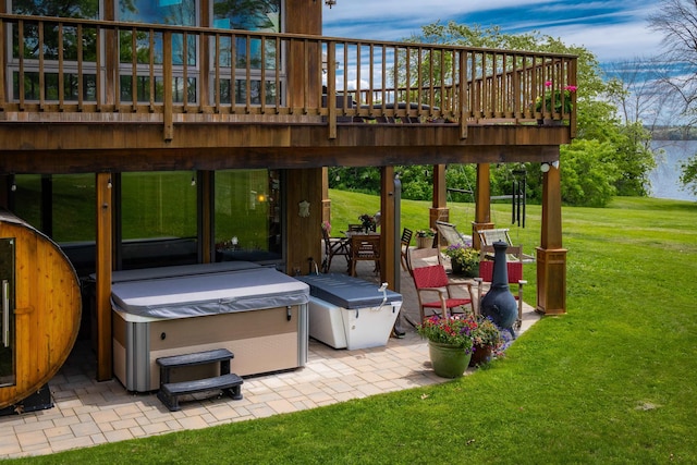 view of patio / terrace featuring a deck and a hot tub