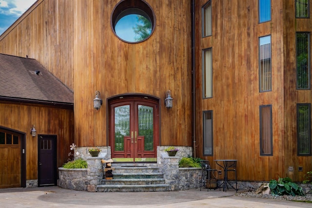 view of exterior entry with a garage