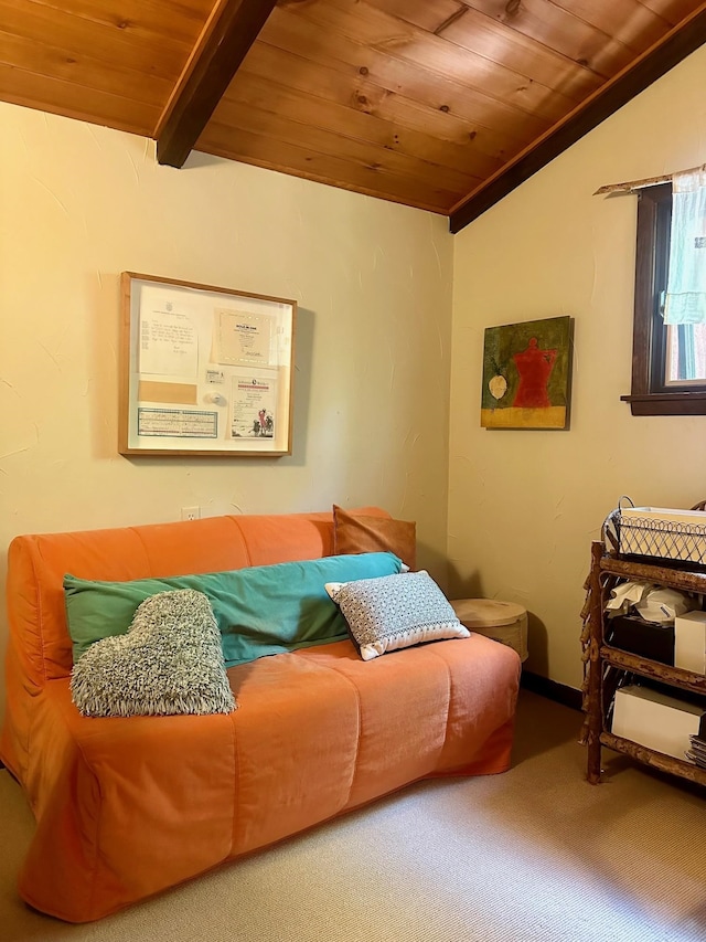 living area featuring vaulted ceiling with beams, wooden ceiling, and carpet