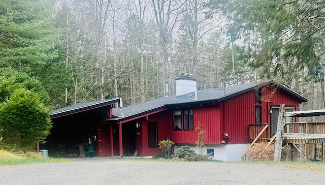 view of front facade featuring a chimney