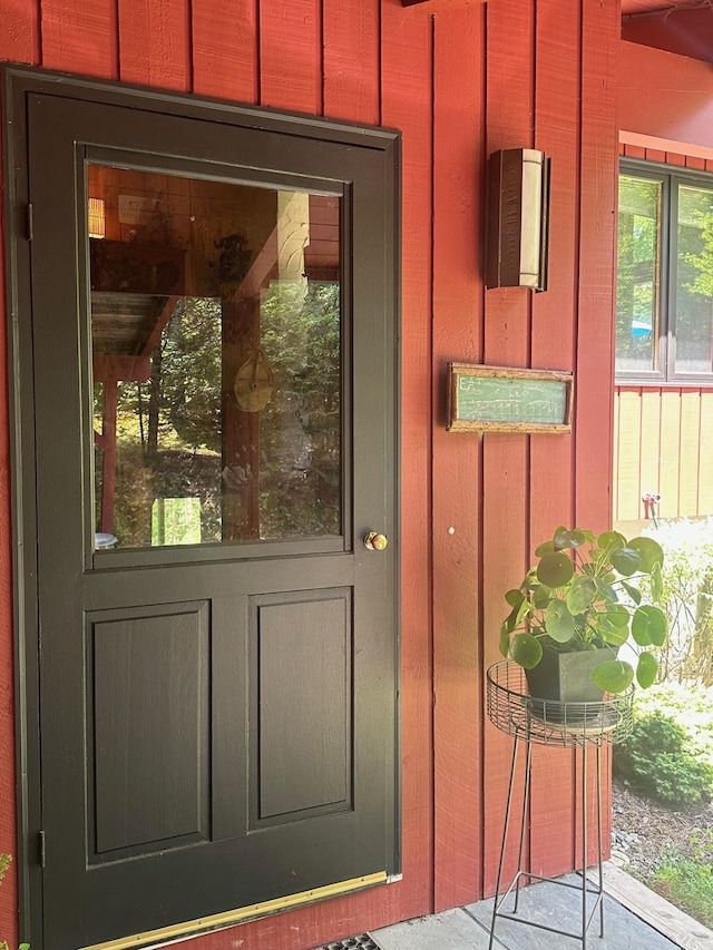 doorway to property with board and batten siding