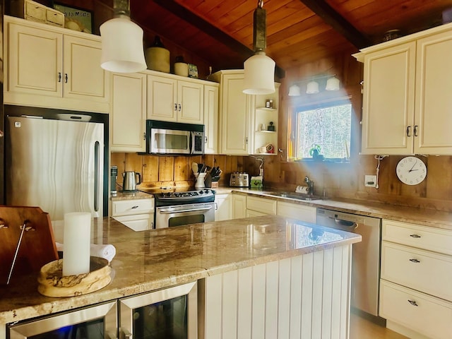 kitchen with beverage cooler, wooden ceiling, appliances with stainless steel finishes, light stone countertops, and a sink