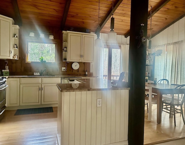 kitchen with decorative backsplash, vaulted ceiling with beams, light wood-type flooring, open shelves, and a sink