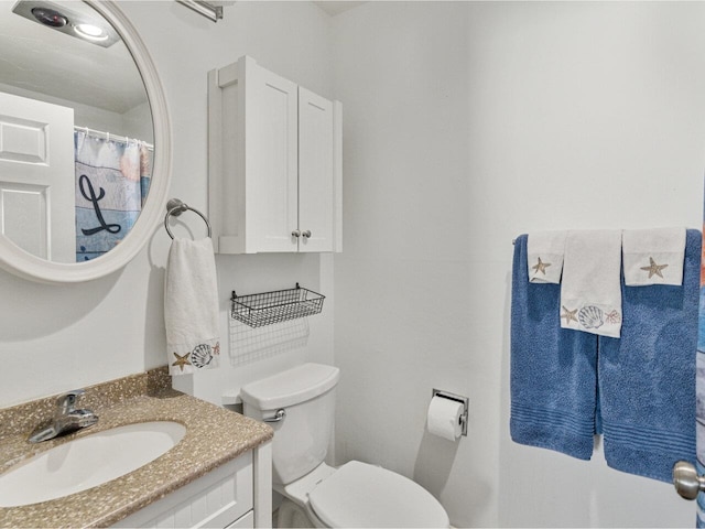 full bathroom with vanity and toilet