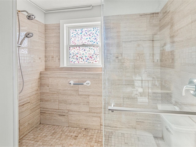 bathroom with tiled shower