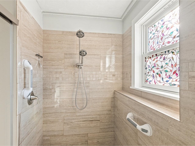 full bath featuring a tile shower