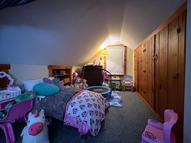 bedroom with carpet flooring and vaulted ceiling