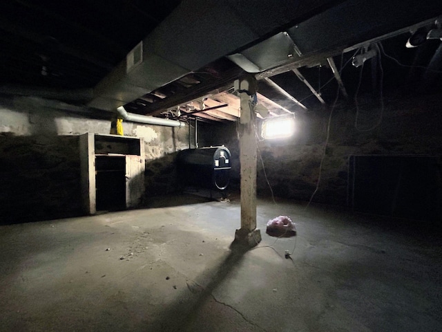 basement with visible vents and heating fuel