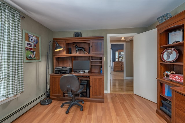 office with a baseboard radiator and light wood finished floors