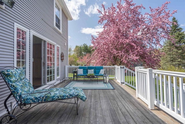 wooden deck with outdoor lounge area