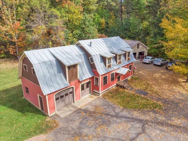 drone / aerial view featuring a view of trees