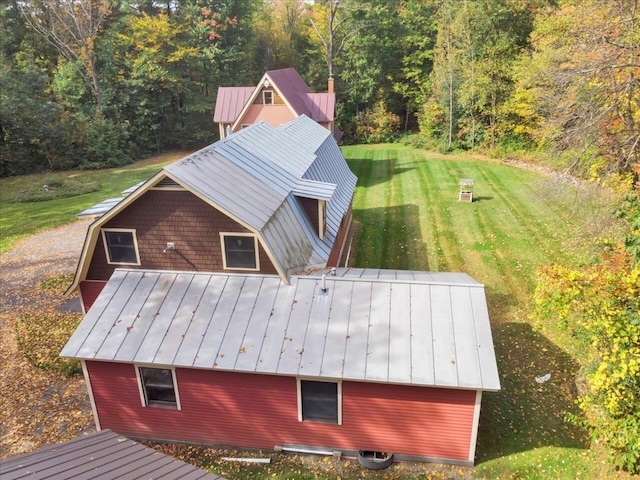 bird's eye view with a wooded view