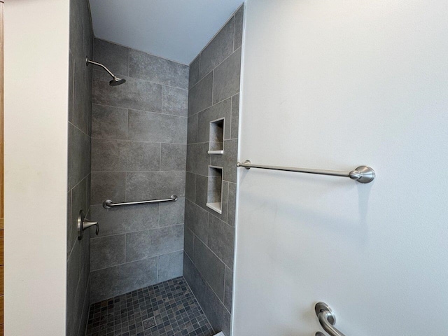 bathroom with tiled shower