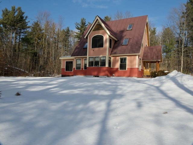 view of front of house with metal roof and a standing seam roof