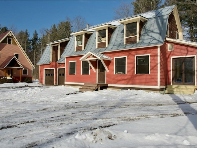 view of front of house with a standing seam roof, metal roof, and a gambrel roof