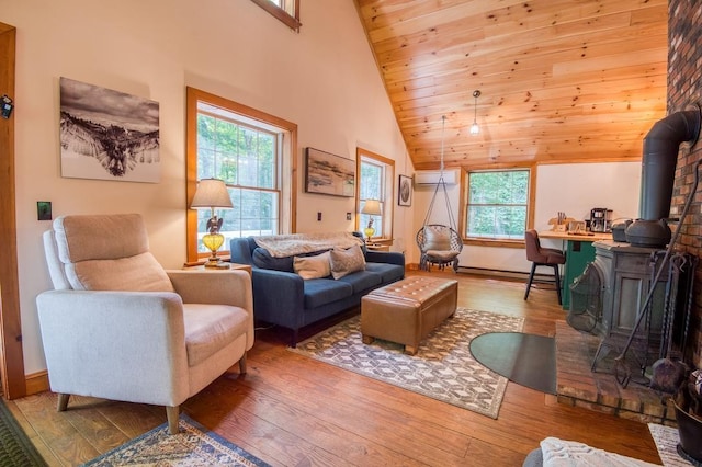 living room featuring wooden ceiling, high vaulted ceiling, hardwood / wood-style floors, and a wall mounted AC