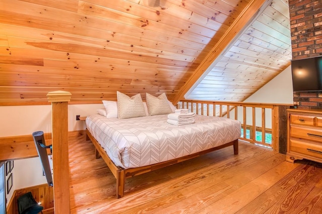 bedroom featuring lofted ceiling, wood ceiling, and light wood-style flooring