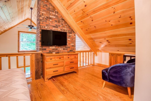 bedroom with vaulted ceiling, light wood-type flooring, and wood ceiling