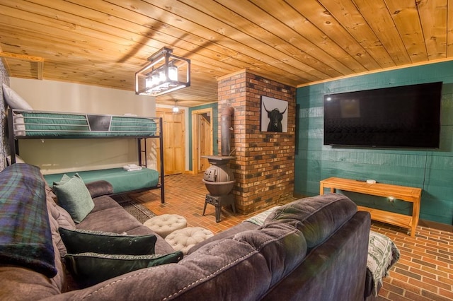 living room featuring wooden ceiling and brick floor