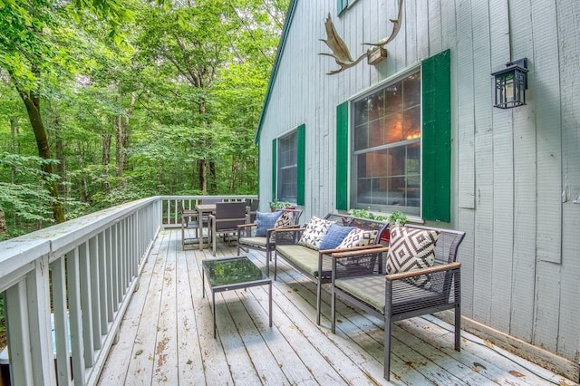 wooden deck featuring an outdoor hangout area