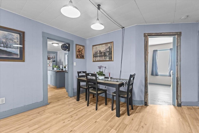 dining room with light wood-style flooring