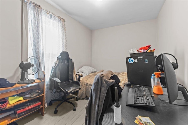 home office with hardwood / wood-style floors