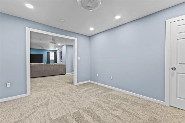 carpeted empty room with recessed lighting and baseboards