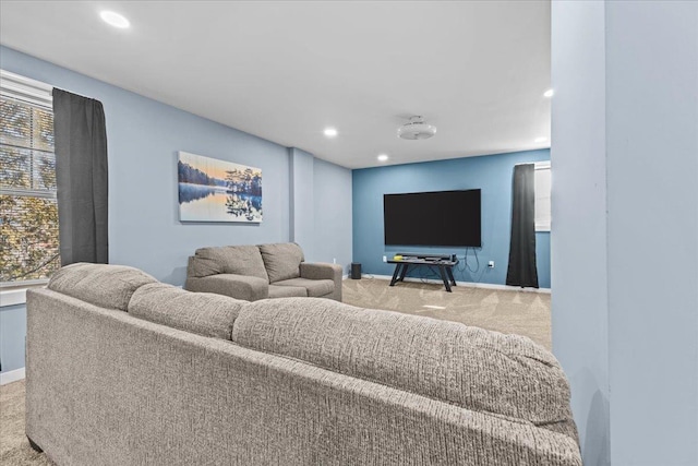 carpeted cinema room featuring baseboards, recessed lighting, and a healthy amount of sunlight