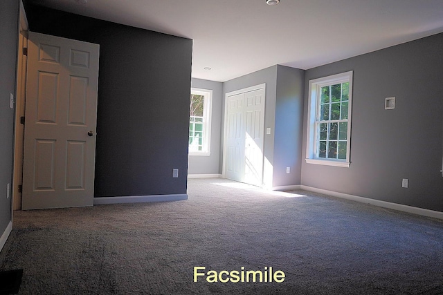 spare room with carpet floors and baseboards