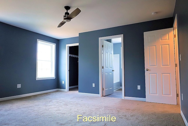 unfurnished bedroom with baseboards, ceiling fan, ensuite bathroom, carpet floors, and a closet