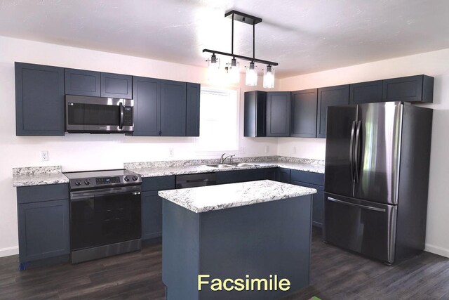 kitchen with light stone counters, a center island, dark wood-style floors, stainless steel appliances, and a sink