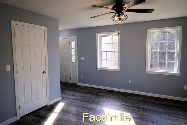 foyer entrance with dark wood-style floors, baseboards, and a ceiling fan