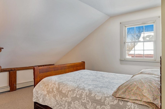 carpeted bedroom with lofted ceiling and a baseboard heating unit