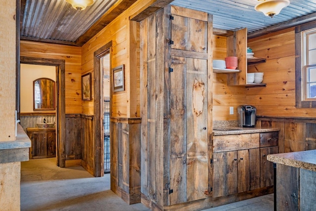 interior space with wooden ceiling and wooden walls