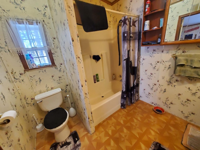 bathroom with toilet, wallpapered walls, and shower / bath combination with curtain