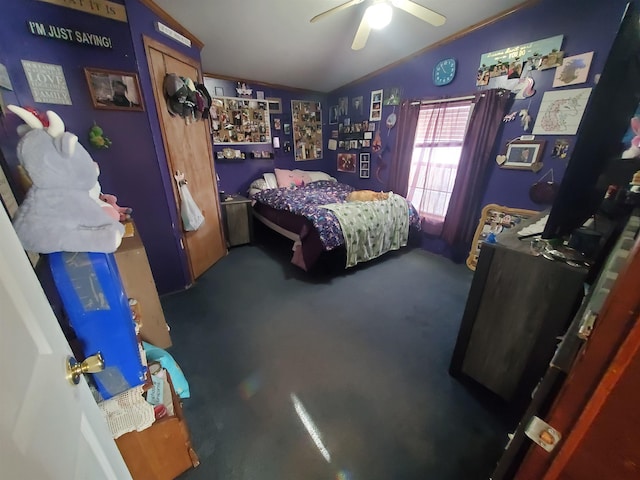 bedroom with lofted ceiling, ceiling fan, and carpet flooring