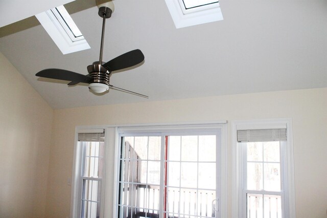 details with a ceiling fan and a skylight